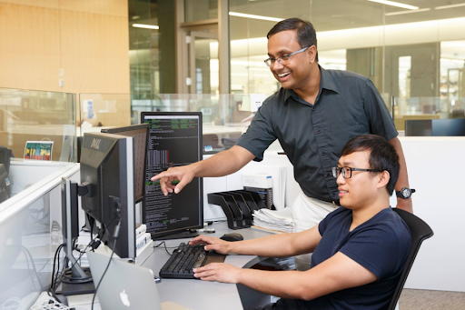 Professor Venkataramani working with a student