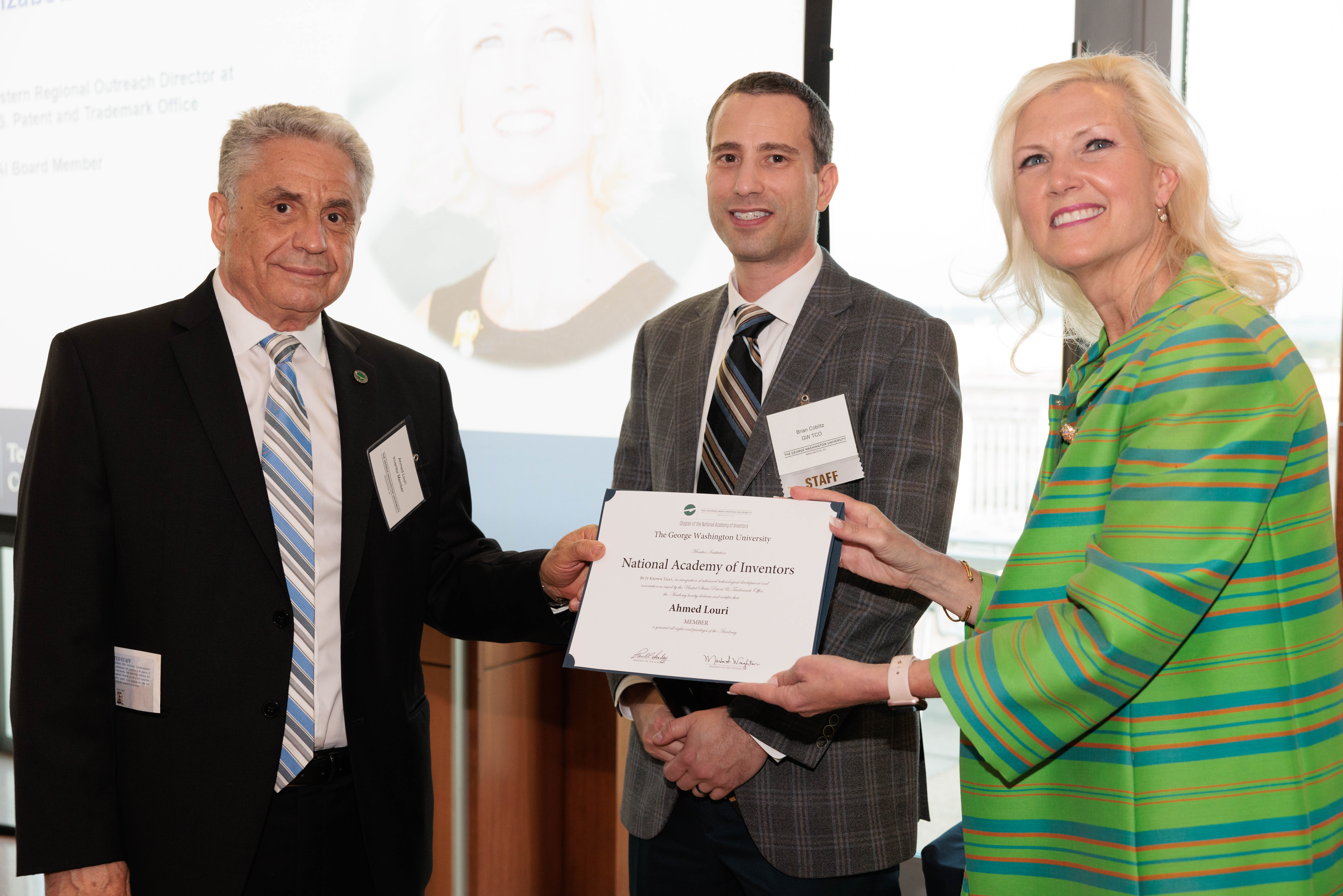 Professor Ahmed Louri receiving his NAI induction certificate