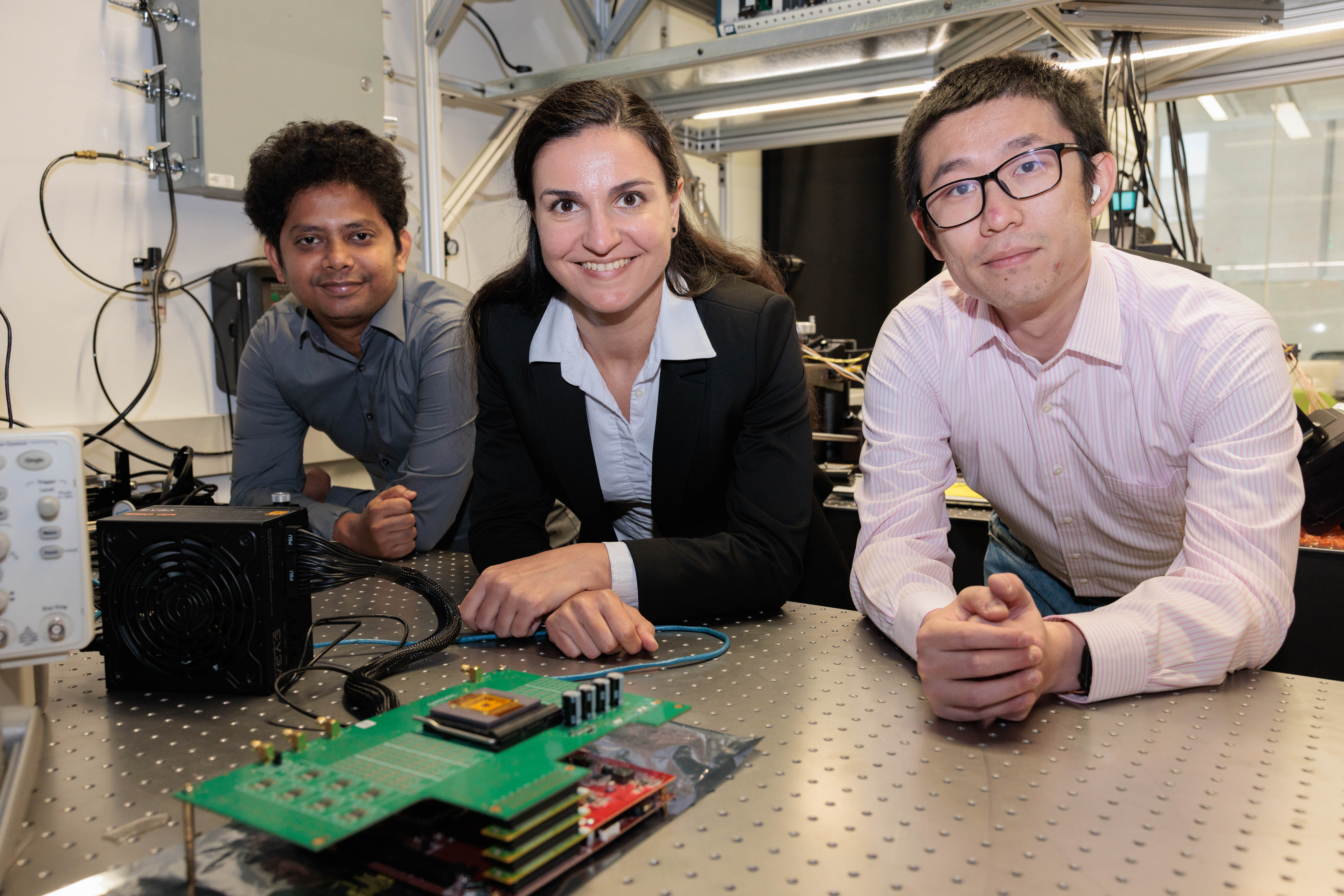 Dr. Gina Adam with her two PhD students, Lei Zhang and Imtiaz Hossen