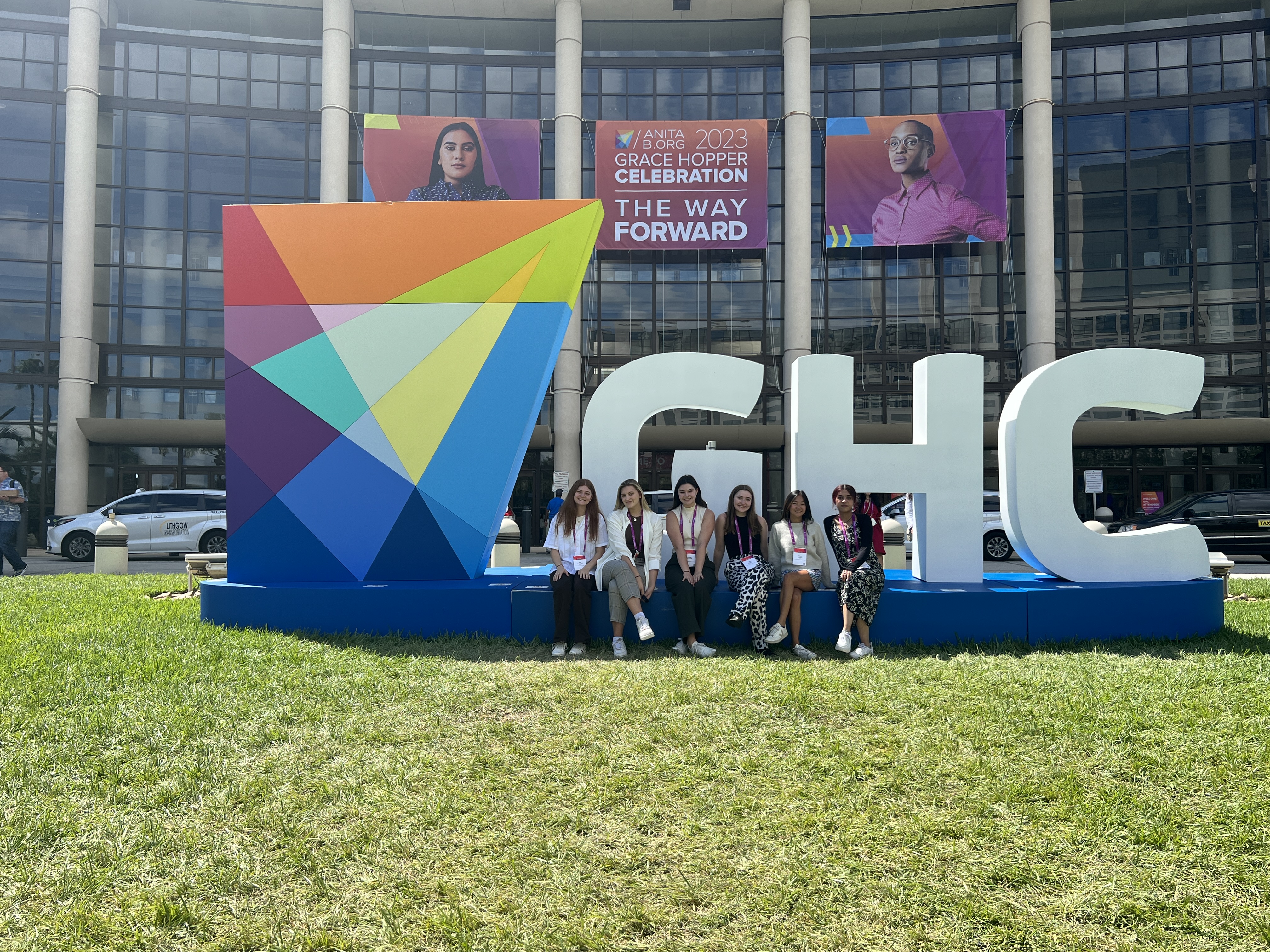 Computer Science undergraduate students posing in front of the GHC sign