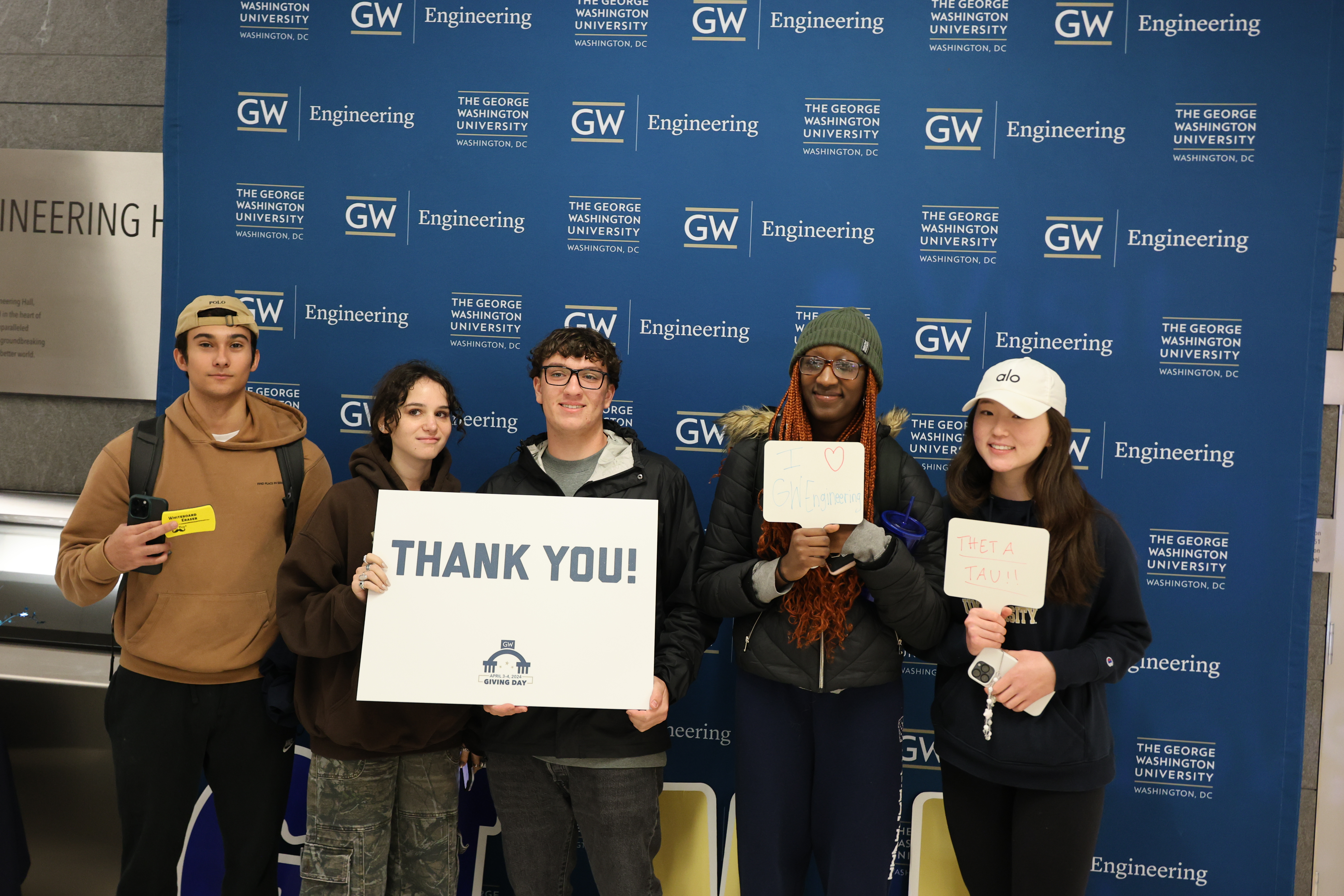 A group of GW Engineering students pictured with a Thank You sign