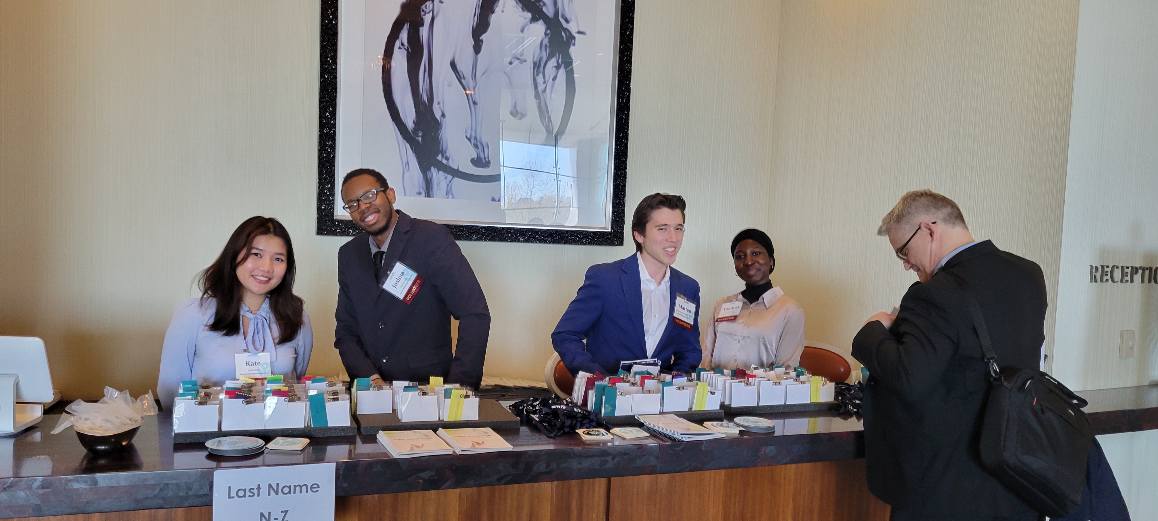 Student volunteers pictured checking in attendees at the annual event