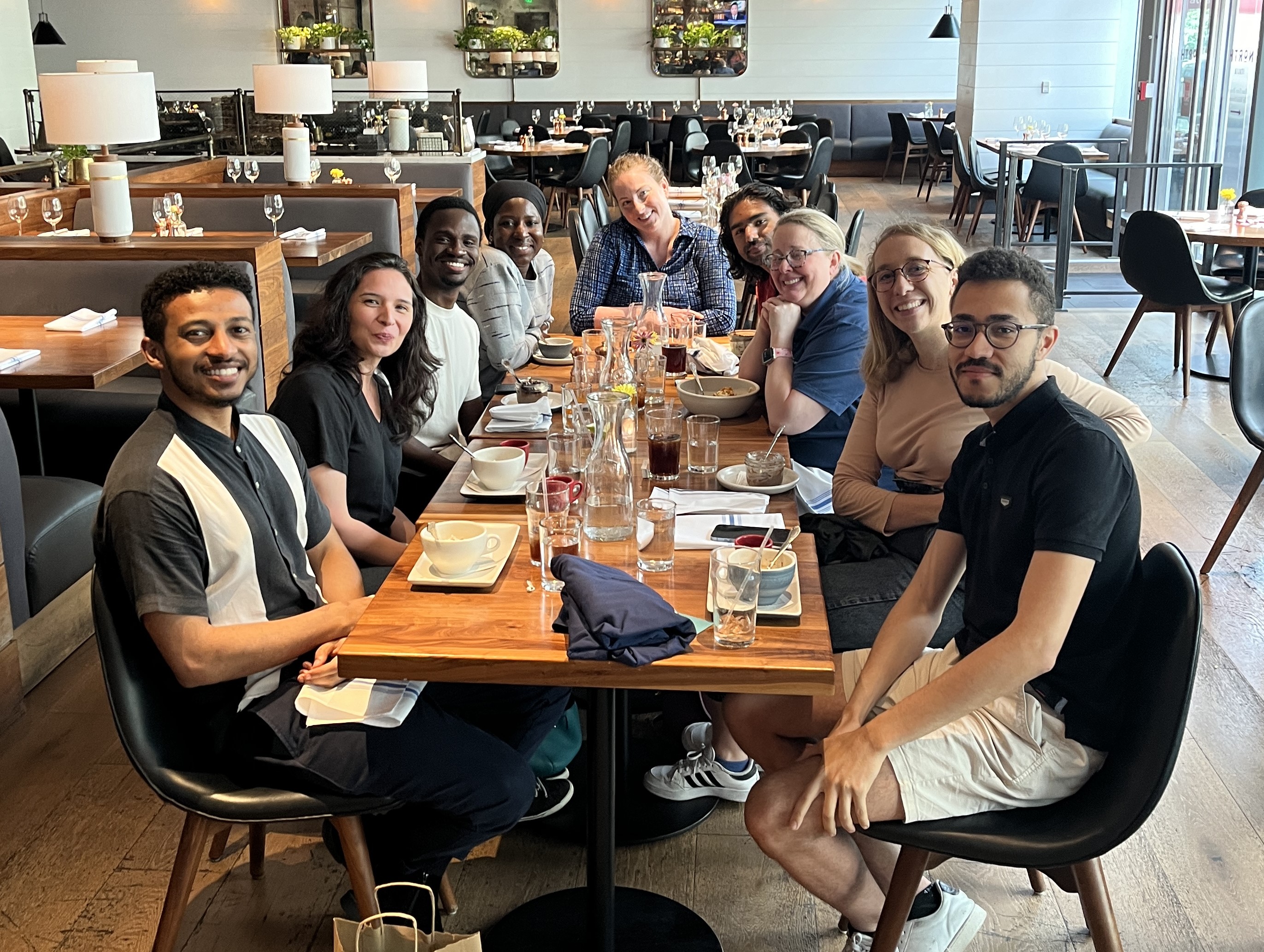 Nahom Melaku, Jeneva Hinojosa, Mobolade Olawale, Tamima Ahmed, Erin Vogt (Staff), Aditya Singh, Dawn Ginnetti (Staff), Bengisu Sisik, and Iyad Ait Hou. Not pictured: Shrinivas Petale.