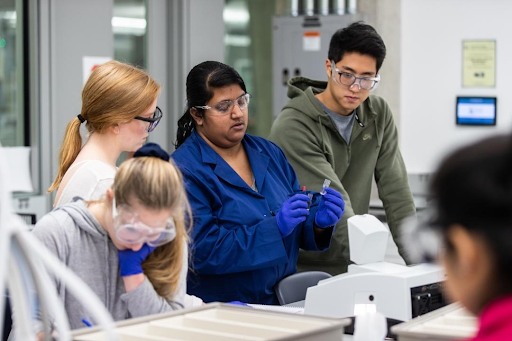 Four students in a chemistry lab