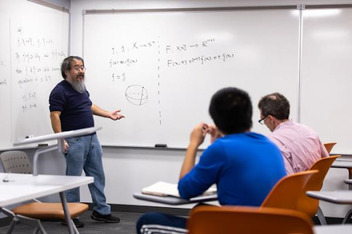 Professor and two students in a class room