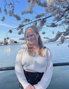 Sara by a river