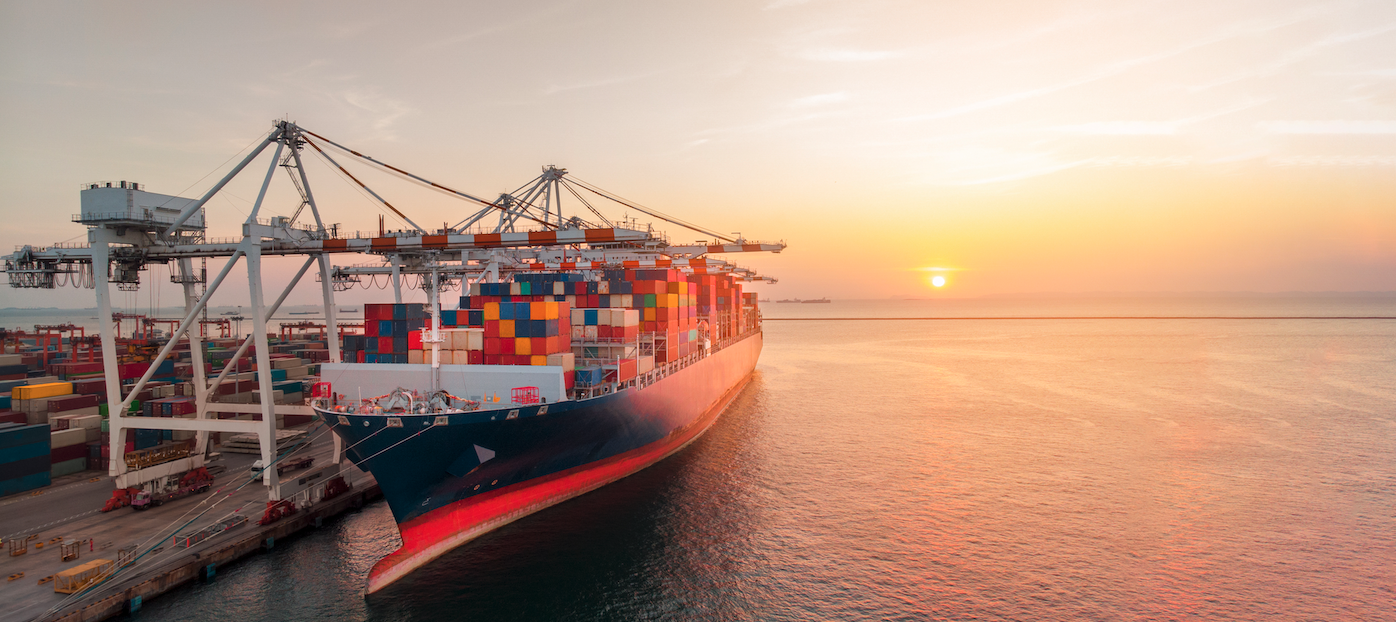 Ship being loaded at sunset