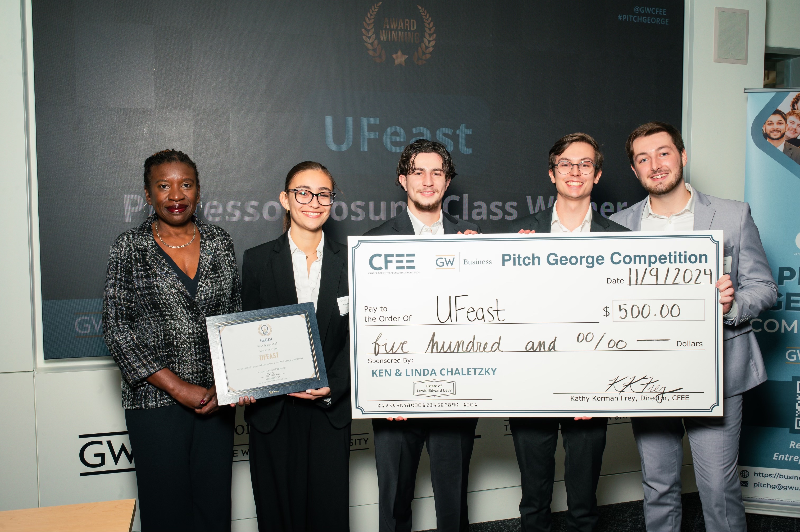 Members of the UFeast team that won first-place at the Pitch George competition in early November pose with some of their winnings. (photo by Daquan Wilson)