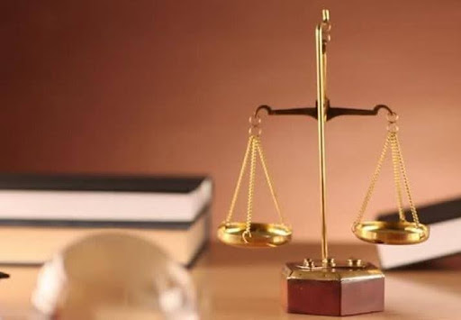 Judicial scale and books on a table