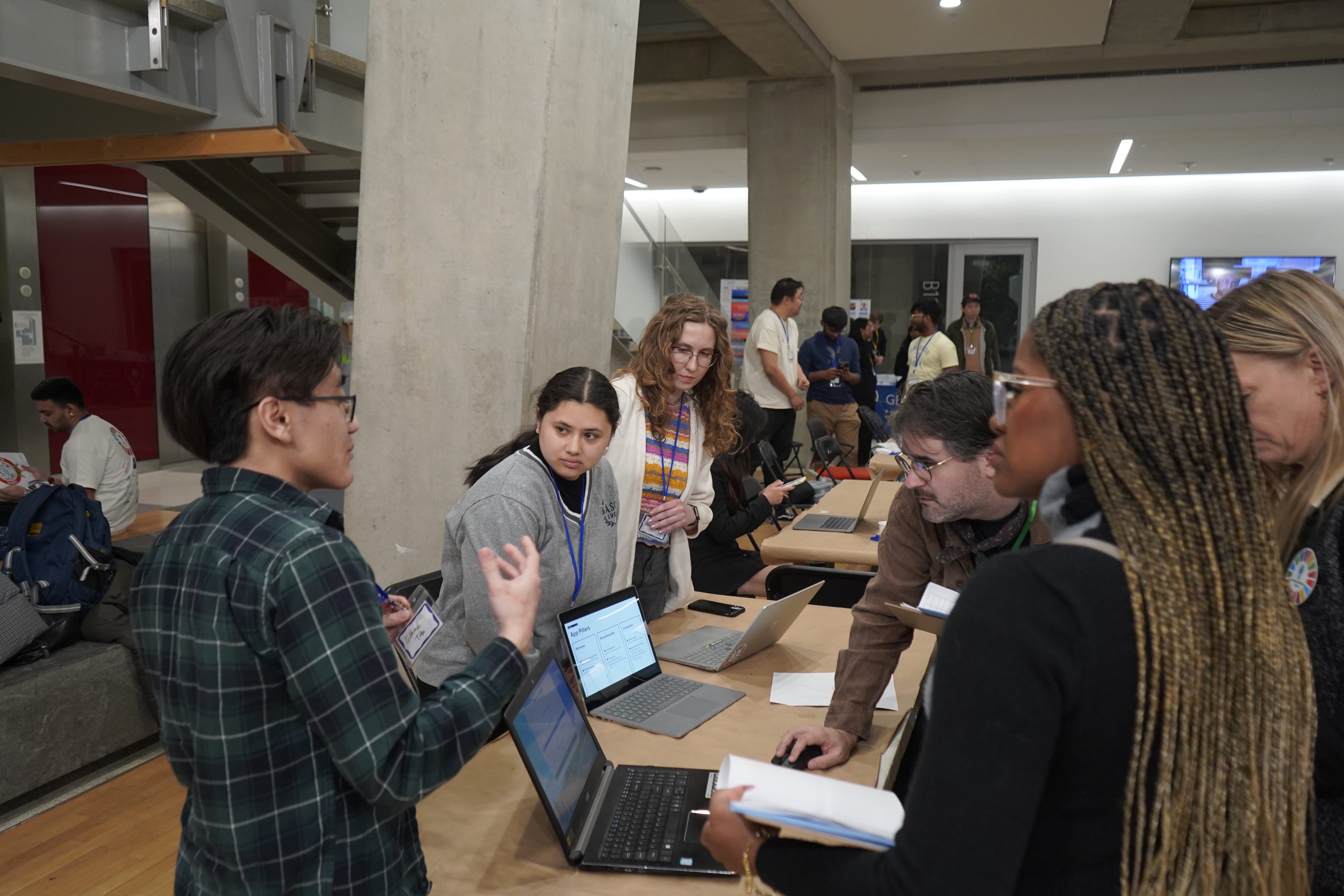 Participants presenting at the hackathon