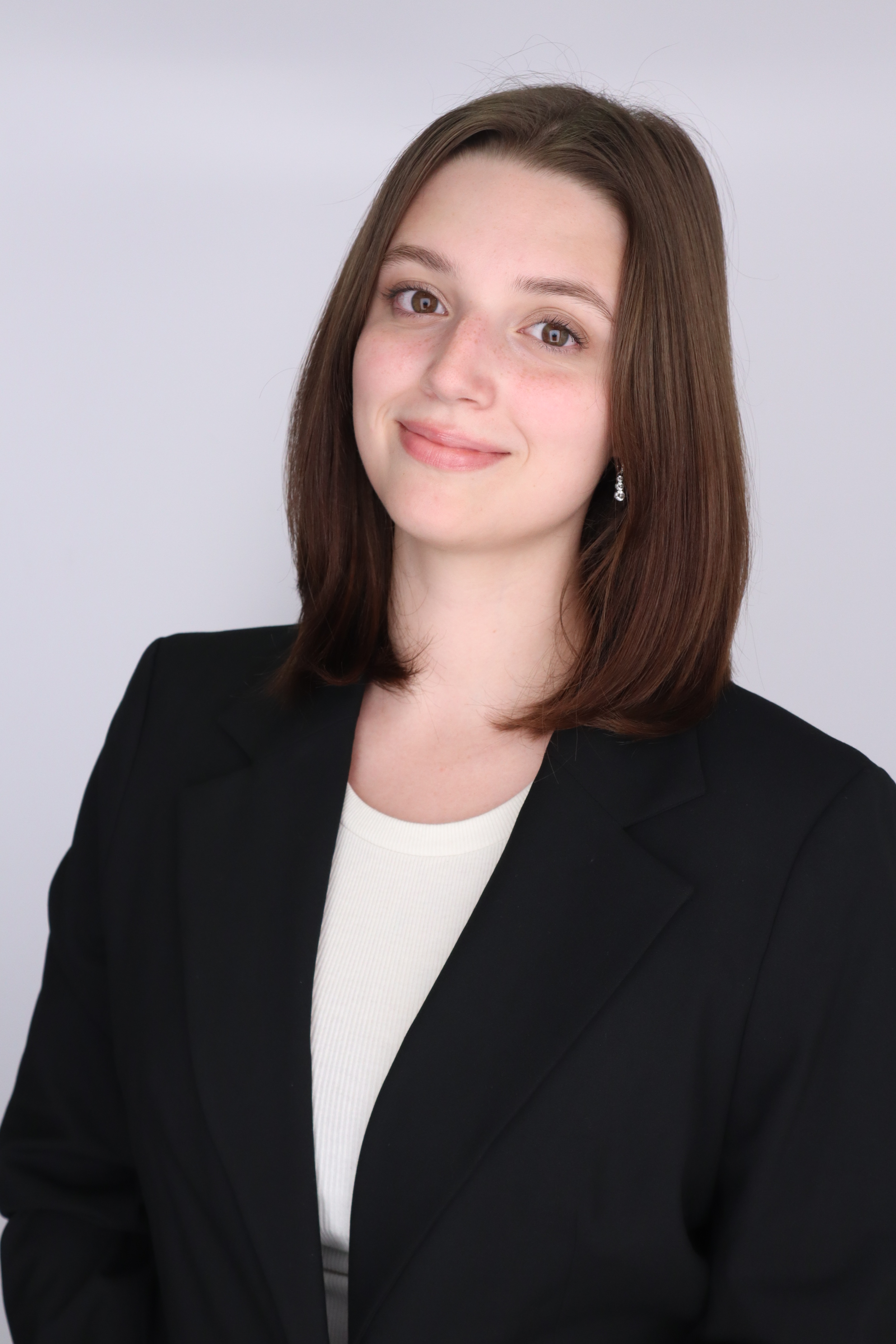 Sophia headshot in a black jacket with a white shirt