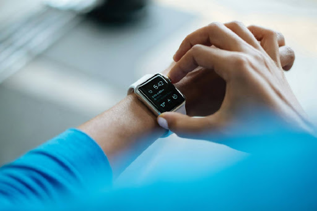 Someone looking at an apple watch