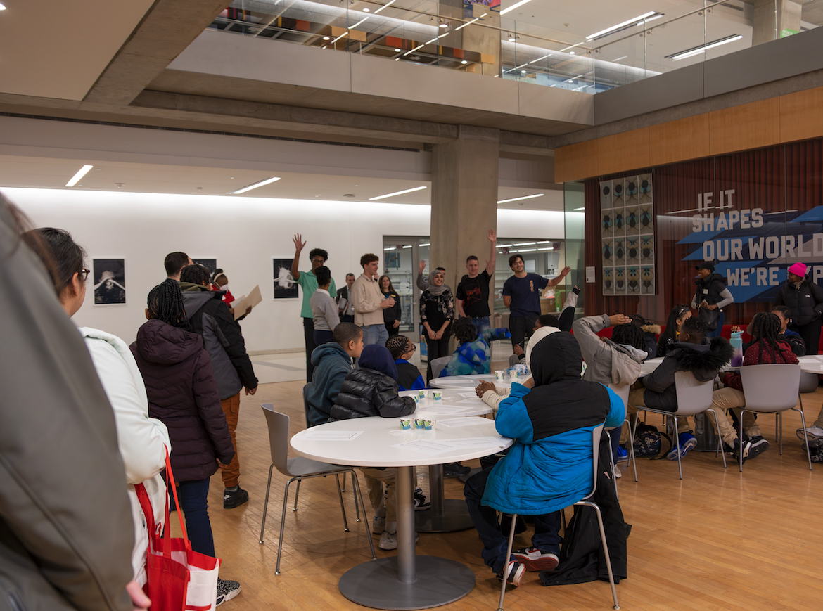 GW Engineering volunteers talk with elementary students