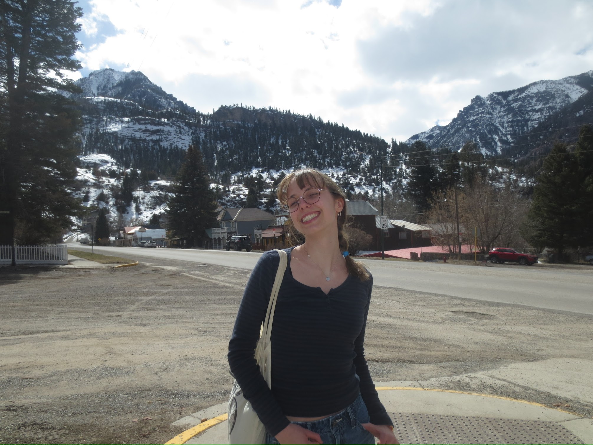 Carly standing in a parking lot