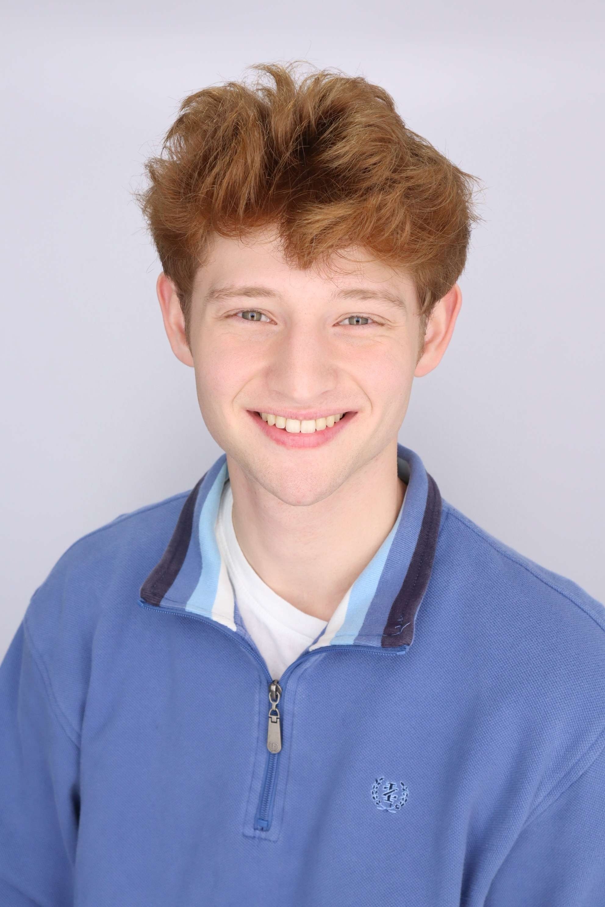 Joshua in a blue polo shirt