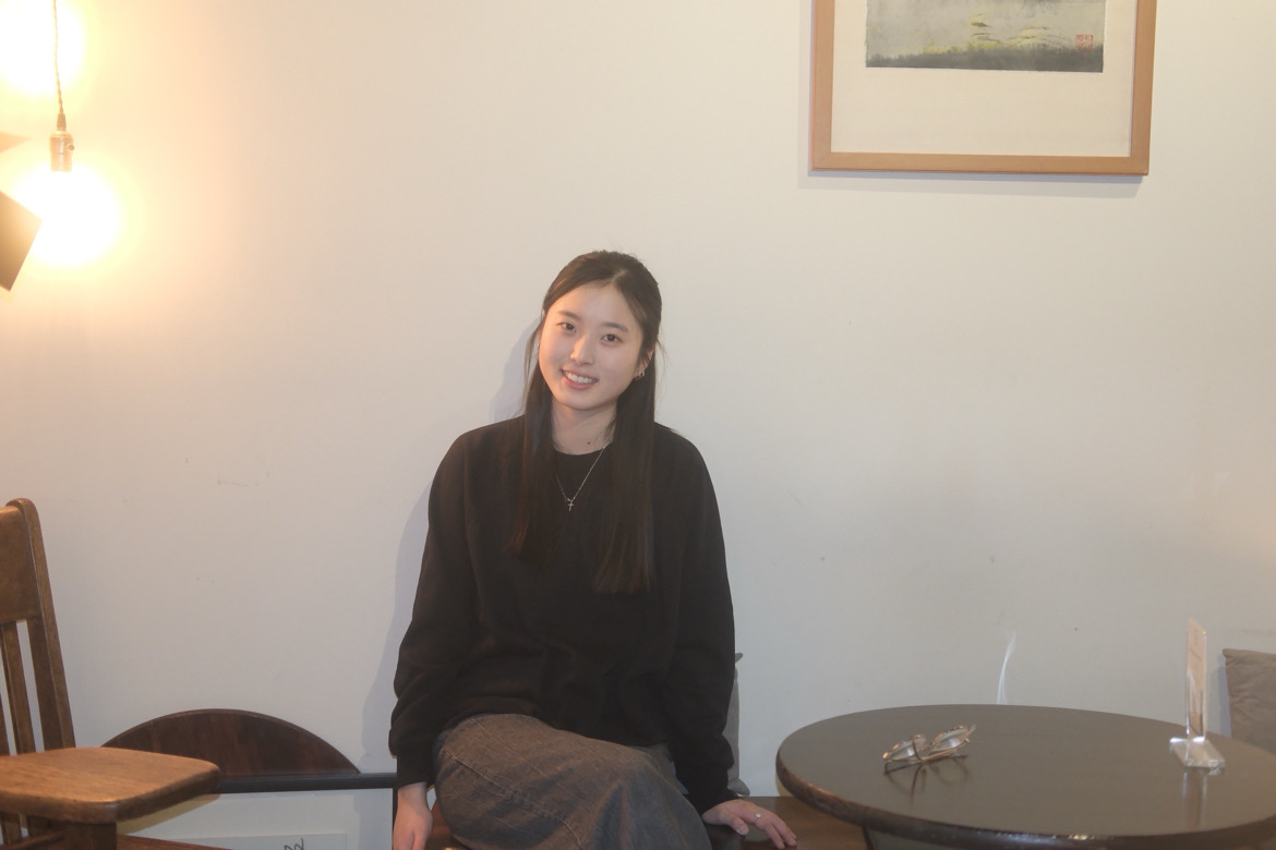 Lindia in a black long sleeve shirt