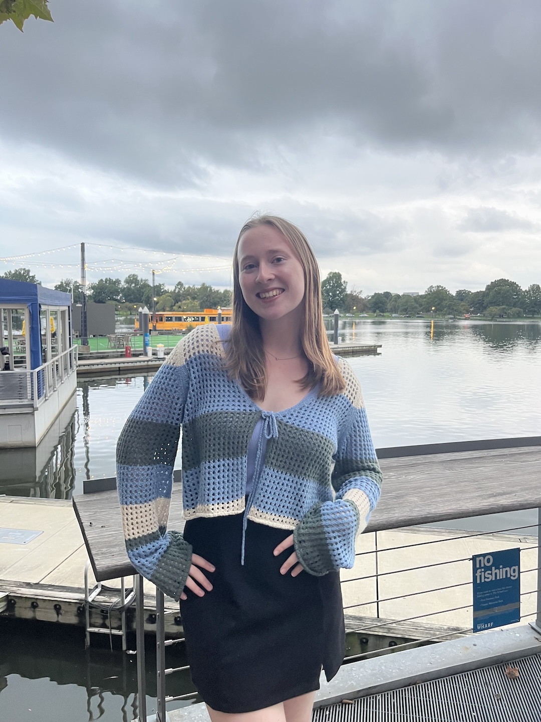 Maggie standing on a boat dock