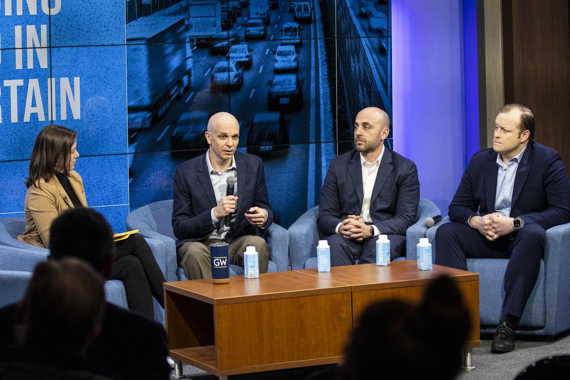 Professor Helveston and Grady discussing with fellow panelists