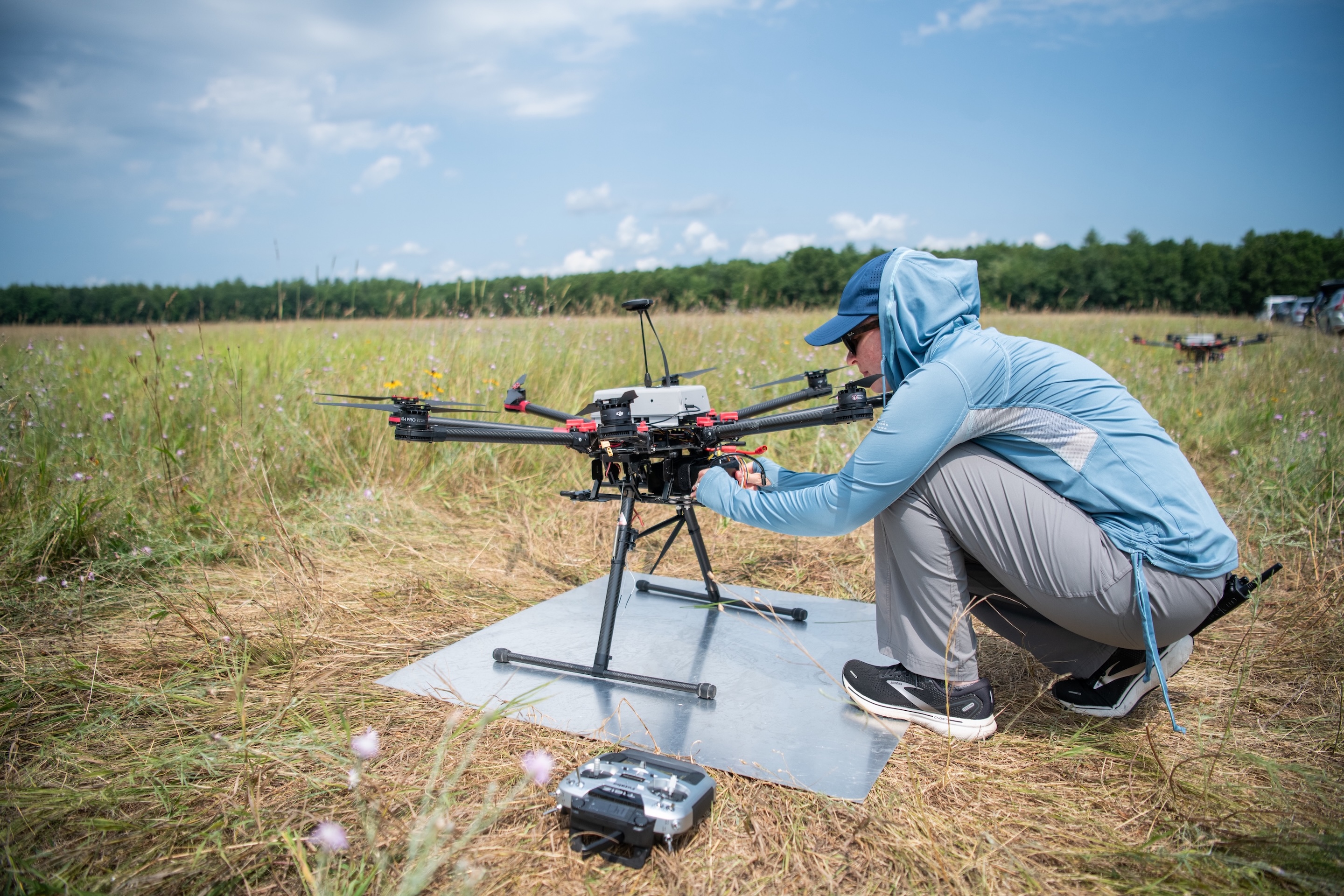 A member of the research team working on a drone while conducting flight tests in Fort Devens, MA. A member of the research team working on a drone while conducting flight tests in Fort Devens, MA.