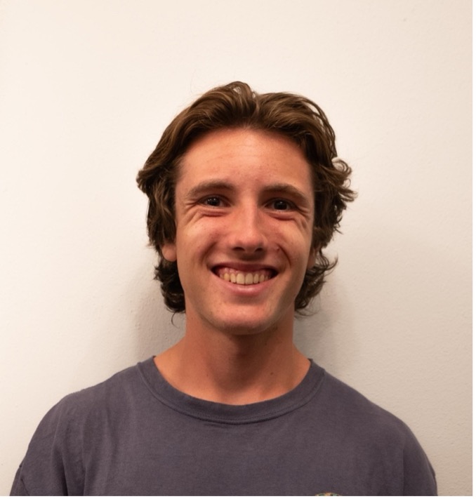 GW Student headshot in a grey shirt