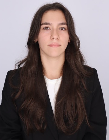 GW Student headshot in a black blazer and white shirt