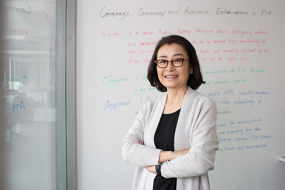 GW Pinpoint; Keeping Information Flowing; photo of professor in lab