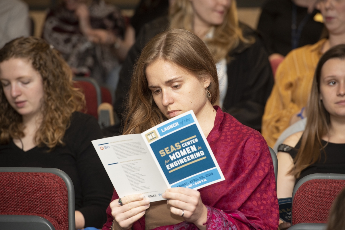 Girl reading a SEAS Women in Engineering pamphlet