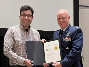 Nelson Jaimes receiving his award at the 2023 SPIE Disruptive Technologies in Information Sciences conference