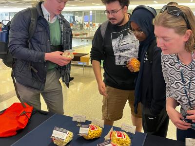 Students choosing their popcorn at the Women's History Celebration Booth