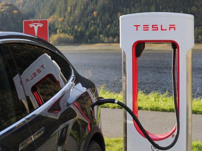 Tesla charging at a station