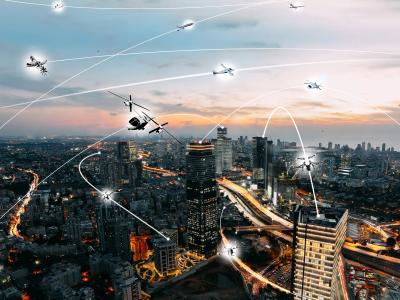 A rendering of what urban airspace might look like in the future, with autonomous aircraft navigating around each other. (NASA)