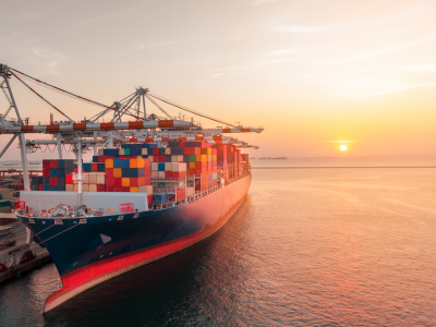 Ship being loaded at sunset