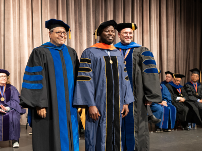 Professor Shahram Sarkani and Dean Lach pictured with Bernard Asare at the Spring 2024 Doctoral Hooding Ceremony. Asare received a doctorate in Cybersecurity Analytics from GW Engineering Online.