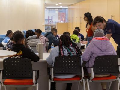 GW Engineering volunteers talk with elementary students