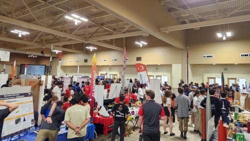 Students attending the fair with company sponsors