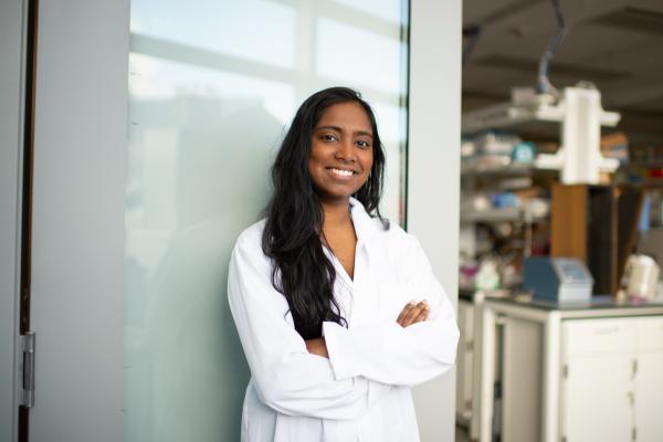 Student standing in front of lab