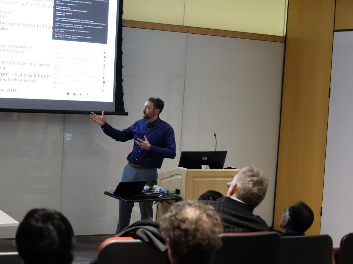 Dr. Adam Hughes giving his talk