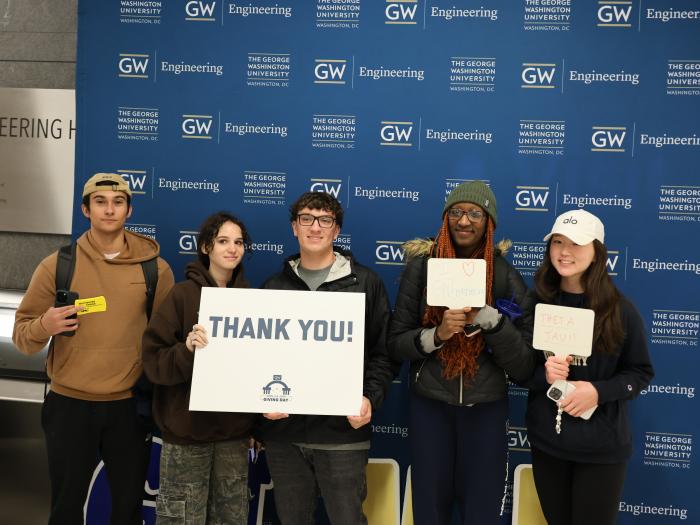A group of GW Engineering students pictured with a Thank You sign