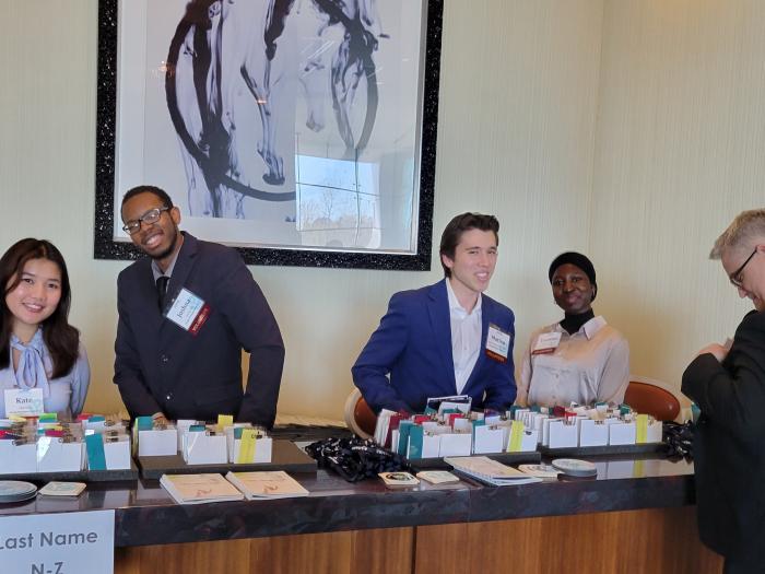 Student volunteers pictured checking in attendees at the annual event