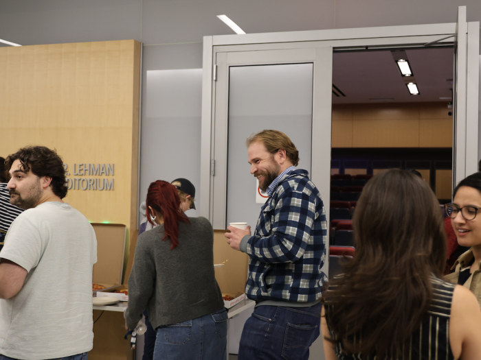 Students getting pizza after the seminar