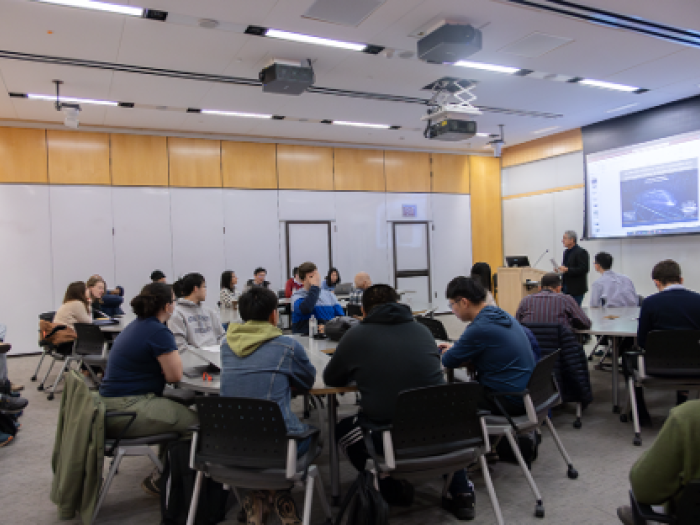 Participants listening to a presentation