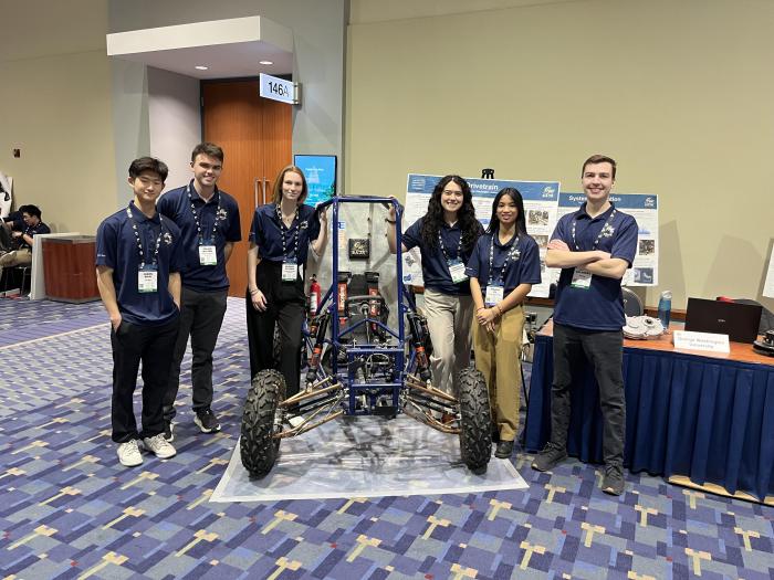 GW Baja members pictured with their car at the event