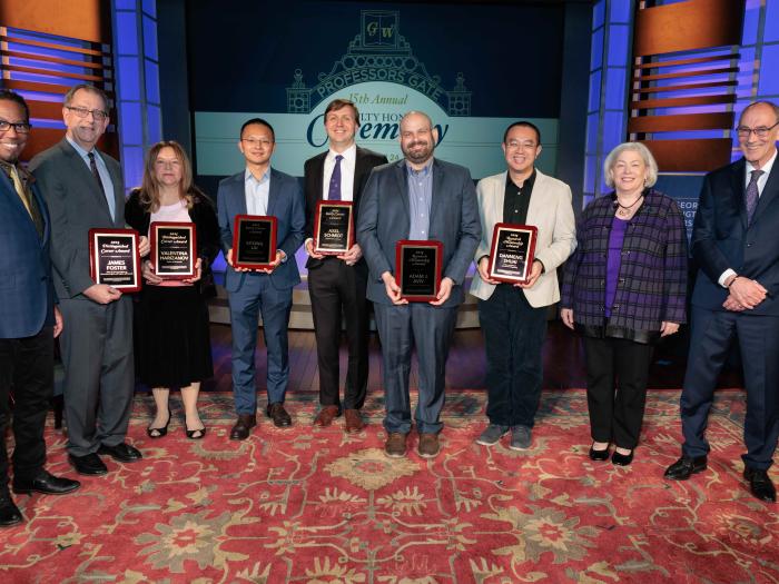 GW Engineering Professors Xitong Liu, Adam Aviv, and Danmeng Shuai pictured with their awards along GW leadership and fellow OVPR awardees.