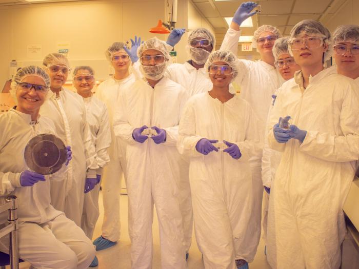 Students in Gina Adam's class holding their microchips