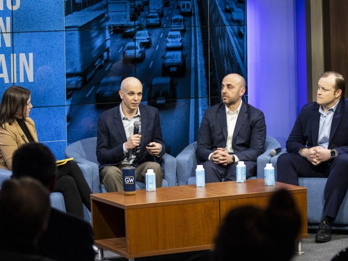 Professor Helveston and Grady discussing with fellow panelists