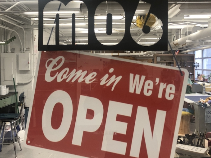 Come in We're Open Sign on Innovation Center Door